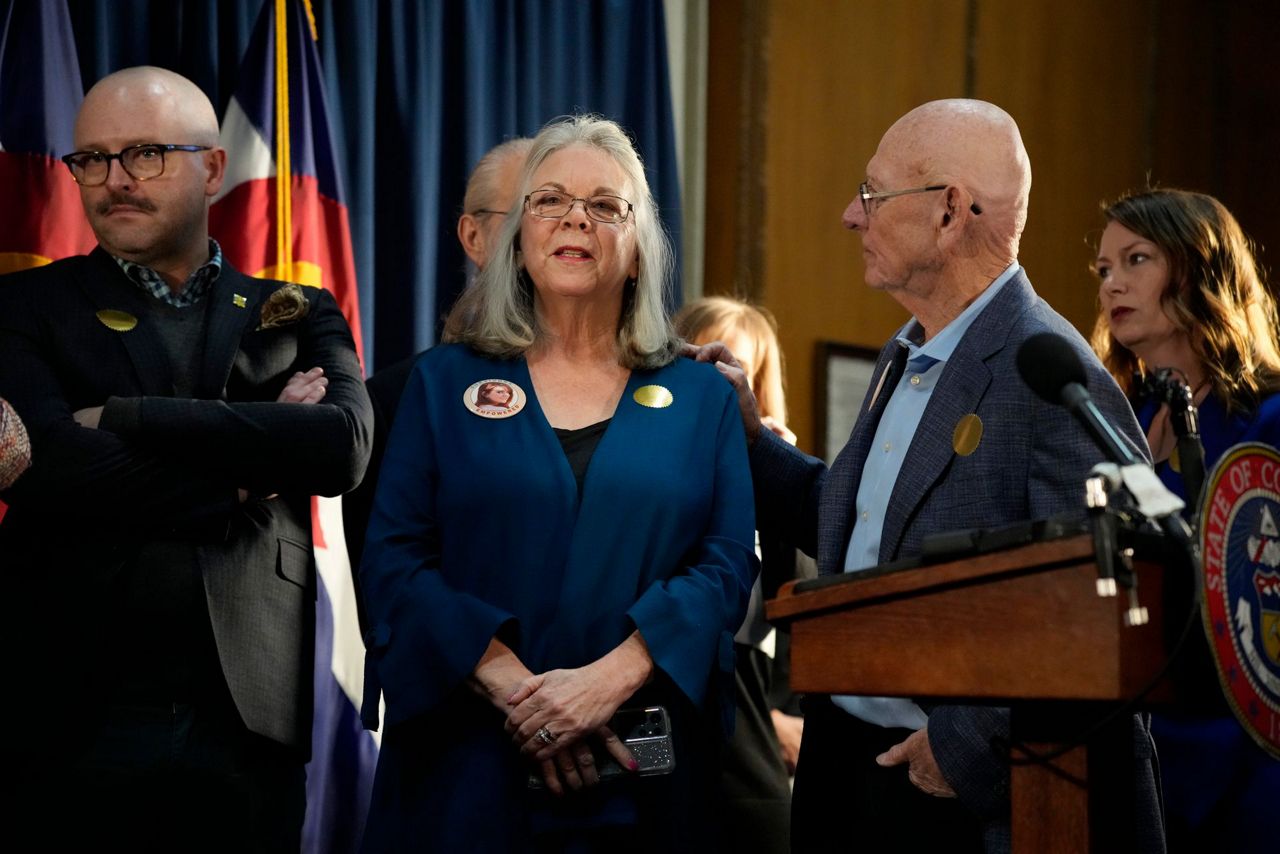 Colorado governor signs gun control bills after massacre