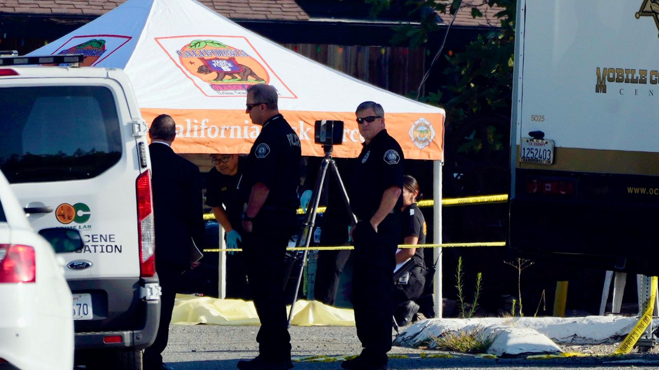 Law enforcement personnel stage at the scene of a mass shooting outside of Cook's Corner, Thursday, Aug. 24, 2023, in Trabuco Canyon, Calif. (AP Photo/Jae C. Hong)