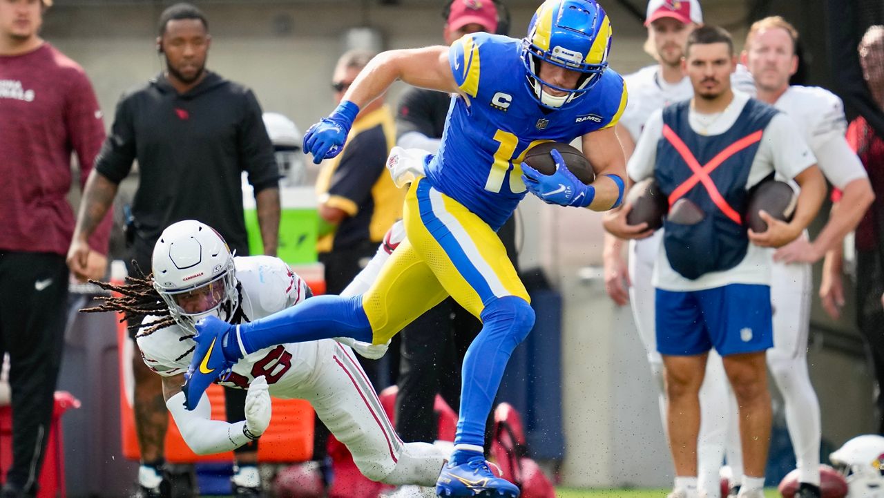 Los Angeles Rams wide receiver Cooper Kupp (10), top, runs past Arizona Cardinals safety Andre Chachere (36) during the first half of an NFL football game Sunday, Oct. 15, 2023, in Inglewood, Calif. (AP Photo/Ashley Landis)