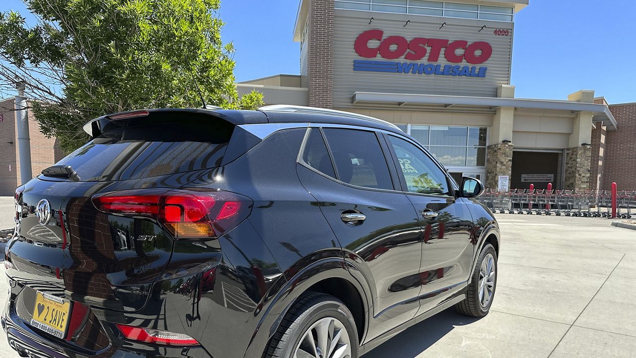 An unsold 2023 Buick Encore sports-utility vehicle sits on display outside a Costco warehouse Monday, July 3, 2023, in Sheridan, Colo. (AP Photo/David Zalubowski)