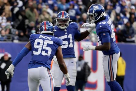 Dallas Cowboys defensive tackle Neville Gallimore (96) celebrates with fans  after an NFL football game against the New York Giants, Sunday, Dec. 19,  2021, in East Rutherford, N.J. The Dallas Cowboys defeated