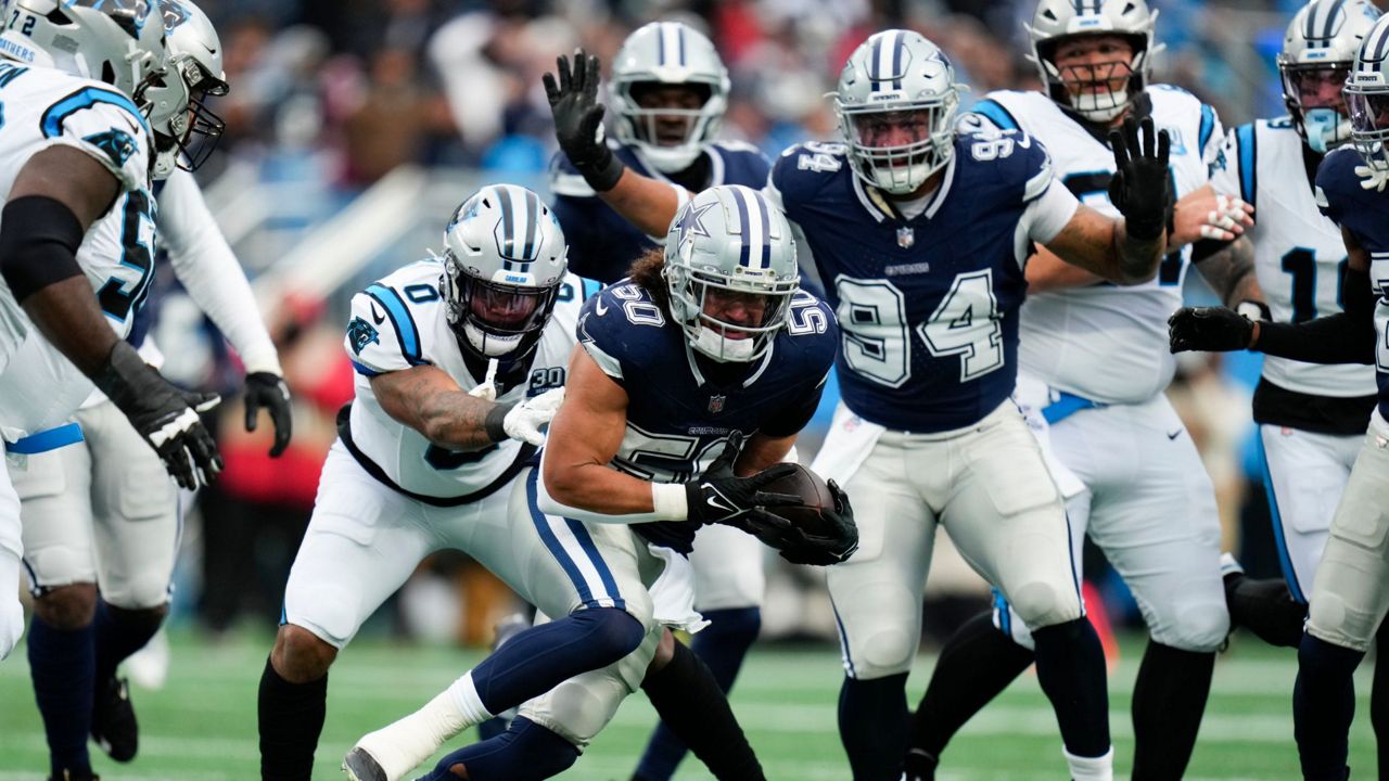 Dallas Cowboys linebacker Eric Kendricks intercepts a pass against the Carolina Panthers during the first half of an NFL football game, Sunday, Dec. 15, 2024, in Charlotte, N.C. (AP Photo/Rusty Jones)