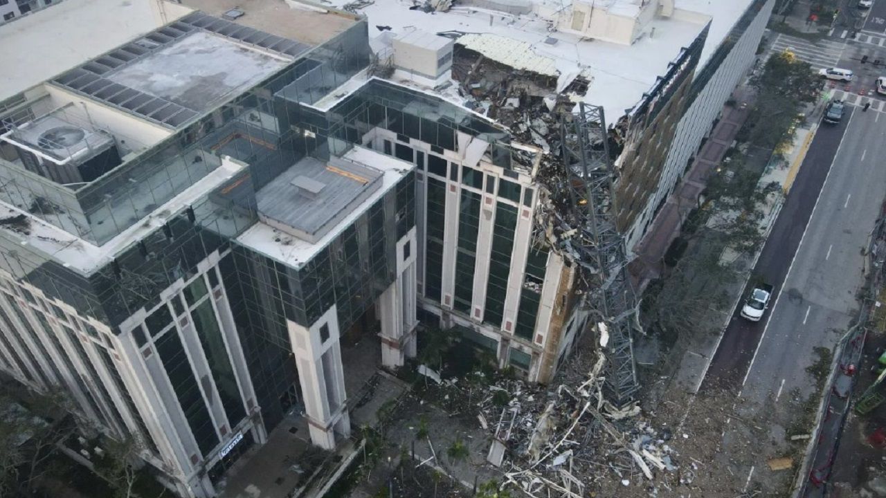 A construction crane fell over into an office building in downtown St. Petersburg during Hurricane Milton. (Tampa Bay Times via AP)