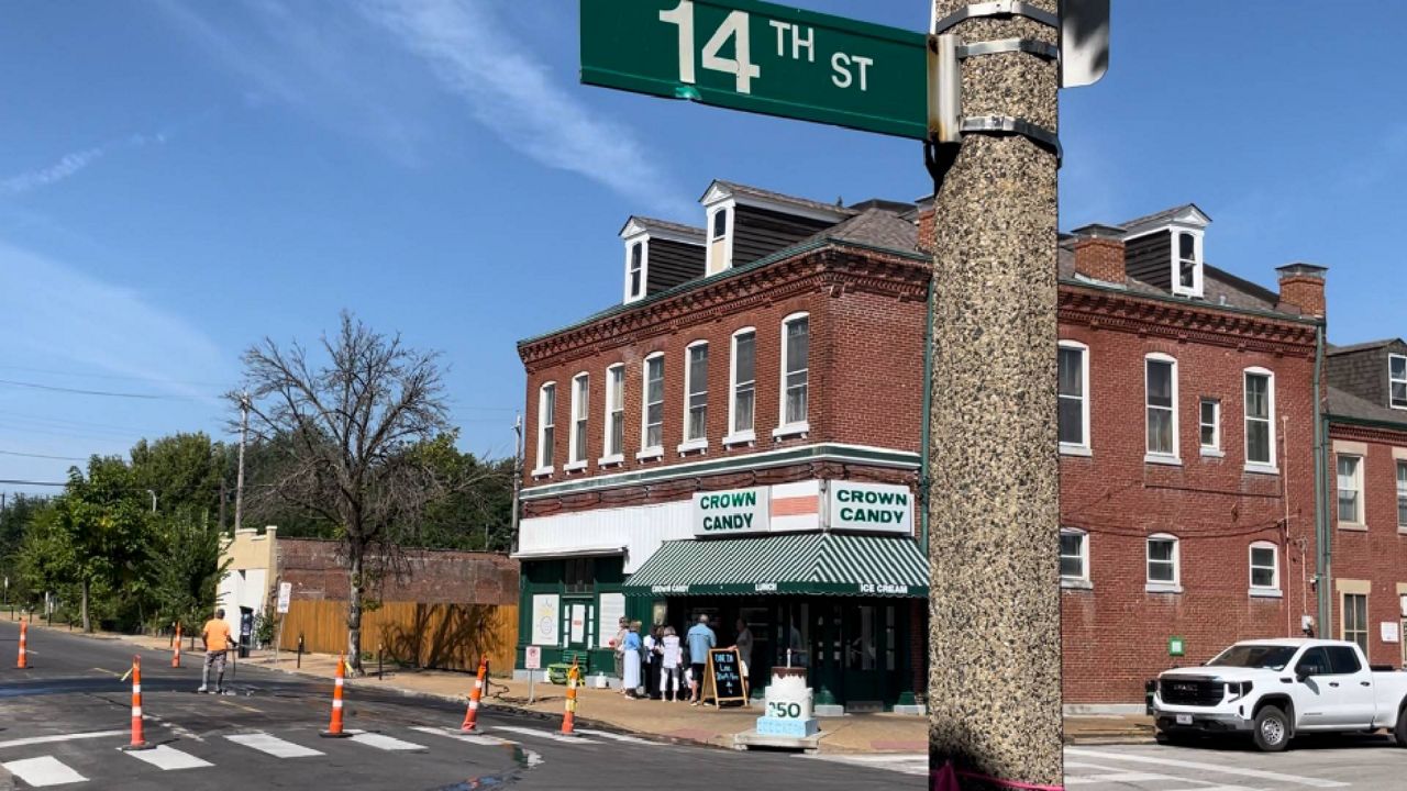 Crews put the finishing touches on speed humps along St. Louis Avenue in the Old North St. Louis neighborhood Friday morning in front of Crown Candy Kitchen. THe stretch of road has been plagued by drivers who run through stop signs and speed well over the post 25 MPH limit. (Spectrum News/Gregg Palermo)