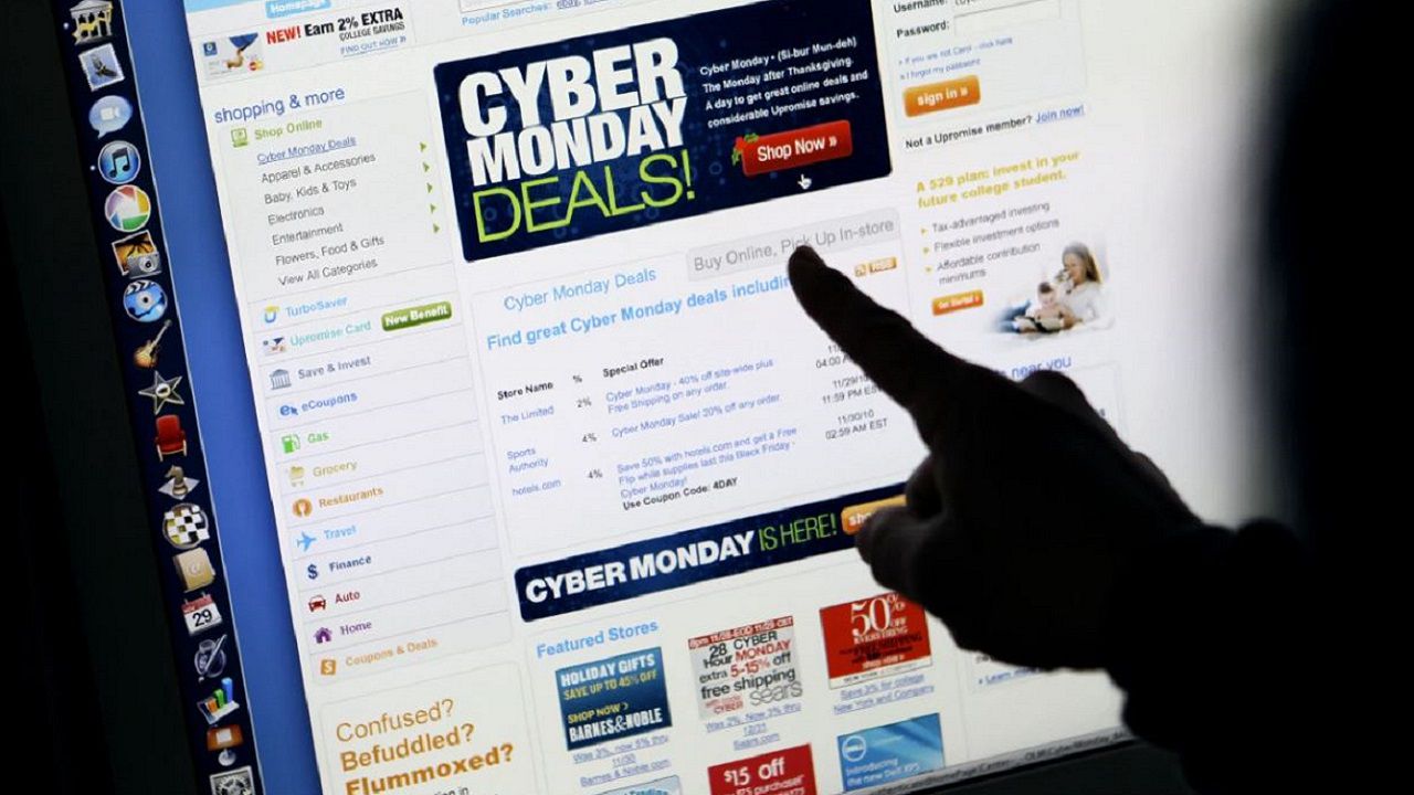 In this file photo, a consumer looks at Cyber Monday sales on her computer. (AP Photo/Paul Sakuma, FILE)