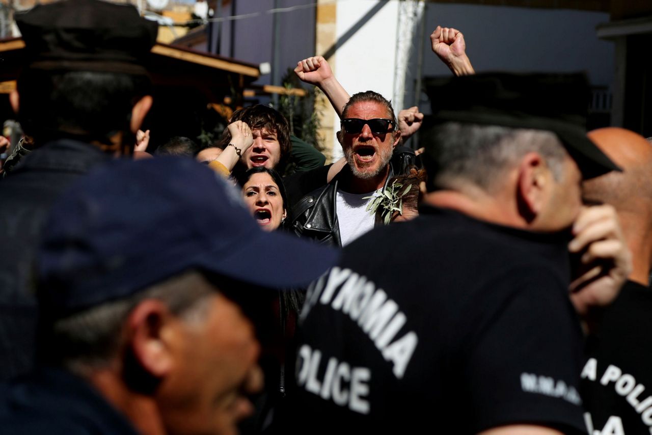 Cyprus police pepper spray protesters at shut crossing point