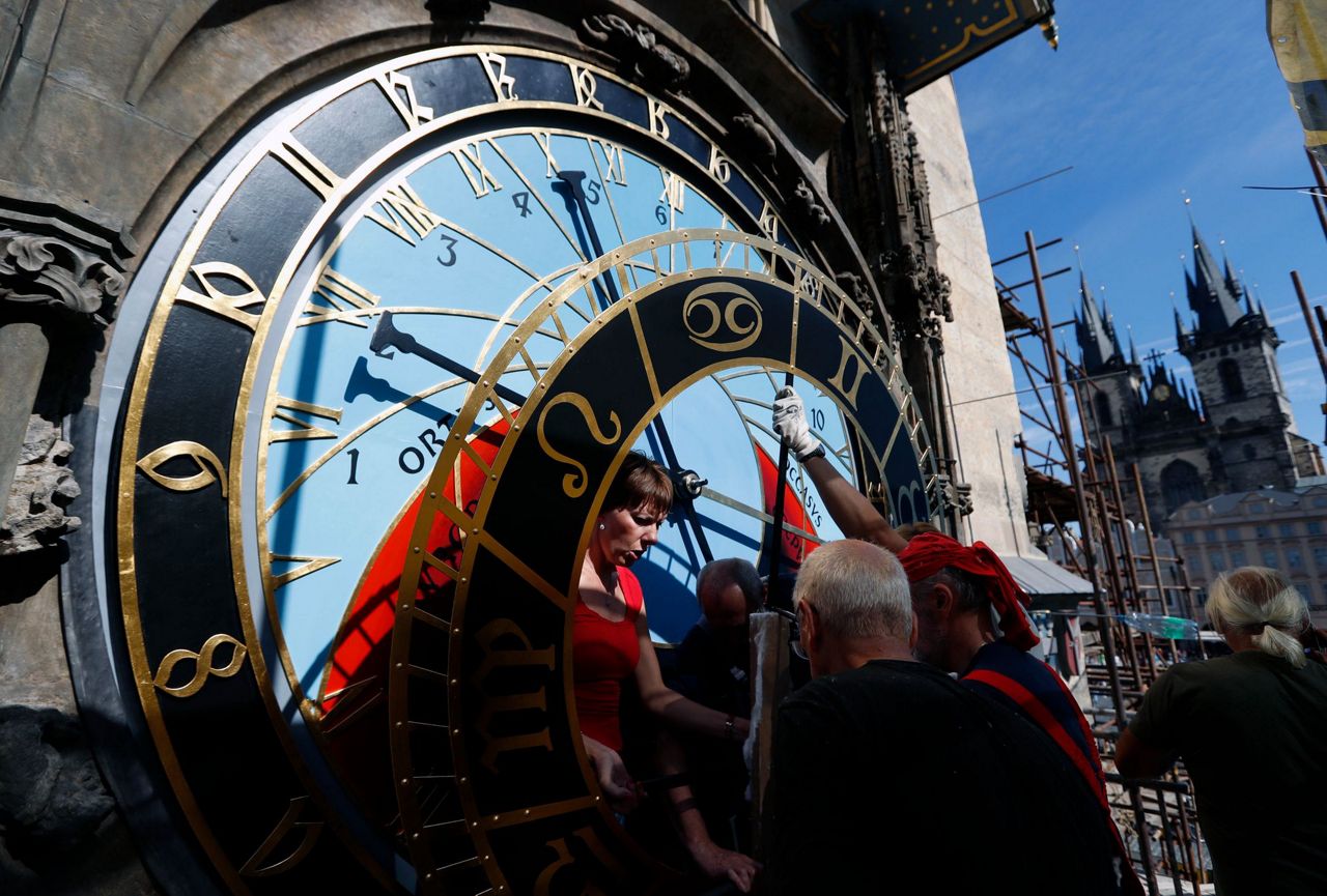Prague's fabled astronomical clock returns in former beauty