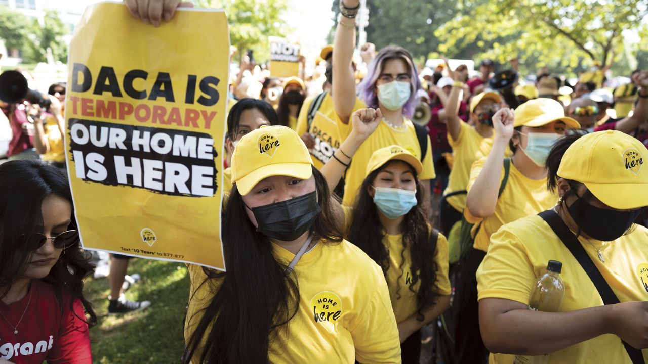 Susana Lujano, left, a dreamer from Mexico who lives in Houston, joins other activists to rally in support of the Deferred Action for Childhood Arrivals program, also known as DACA, at the U.S. Capitol in Washington, June 15, 2022. (AP Photo/J. Scott Applewhite)