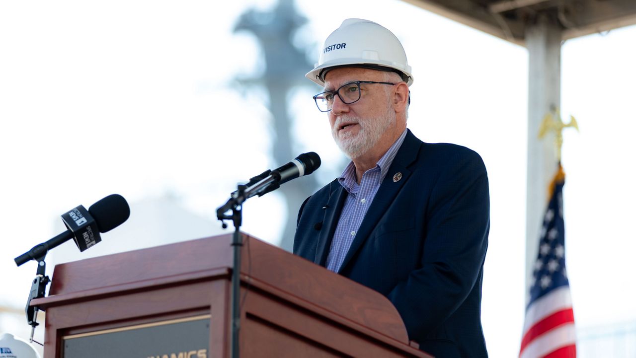 Deputy Under Secretary of the Navy for Management Neil W.T. Hogg speaks on behalf of the Navy at the keel laying of the future USS John E. Kilmer at General Dynamics Bath Iron Works’ shipyard in Bath, Maine, on Sept. 10, 2026. (Bath Iron Works)