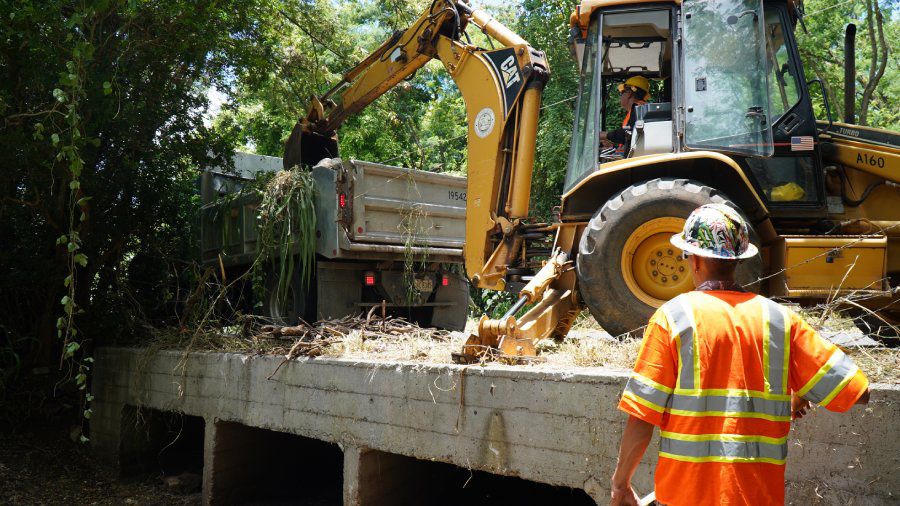 In preparation for Calvin's arrival, Honolulu's Department of Facility Maintenance crews spent Friday removing branches and other debris that was blocking a drainage culvert in Waimanalo. (Photo by City & County of Honolulu)