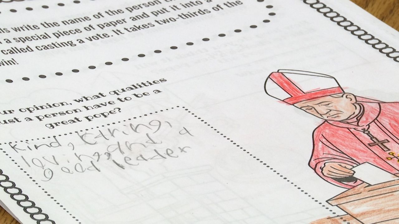 Students learn more about the pope selection process through learning activities at Divine Mercy Catholic School in South Milwaukee