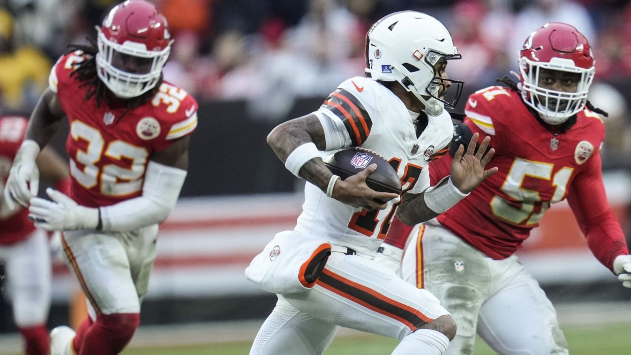 Cleveland Browns quarterback Dorian Thompson-Robinson (17) runs against Kansas City Chiefs defensive end Mike Danna (51) during the second half of an NFL football game, Sunday, Dec. 15, 2024, in Cleveland. (AP Photo/Sue Ogrocki)