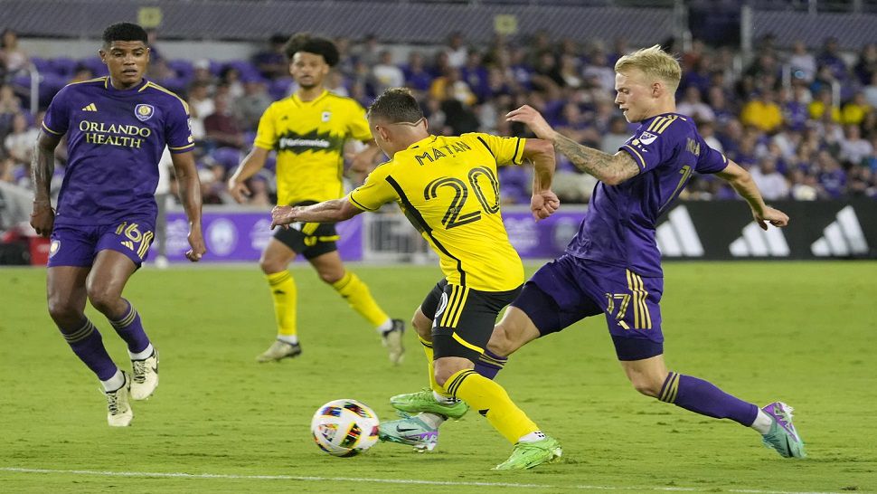 Orlando City midfielder Dagur Thorhallsson battles for the ball against Columbus midfielder Alexandru Matan during the second half of Saturday night's game.