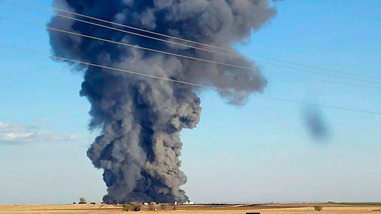 In this photo provided by Castro County Emergency Management, smoke fills the sky after an explosion and fire at the Southfork Dairy Farms near Dimmitt, Texas, on April 10, 2023. (Castro County Emergency Management via AP, File)