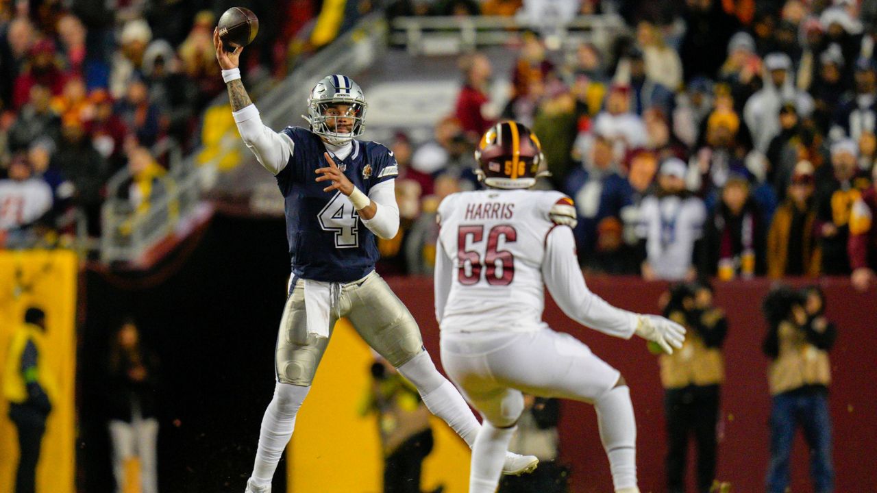 Dallas Cowboys quarterback Dak Prescott (4) throwing the ball over Washington Commanders defensive end Jalen Harris (56) looks on during the first half of an NFL football game, Sunday, Jan. 7, 2024, in Landover, Md. (AP Photo/Jessica Rapfogel)