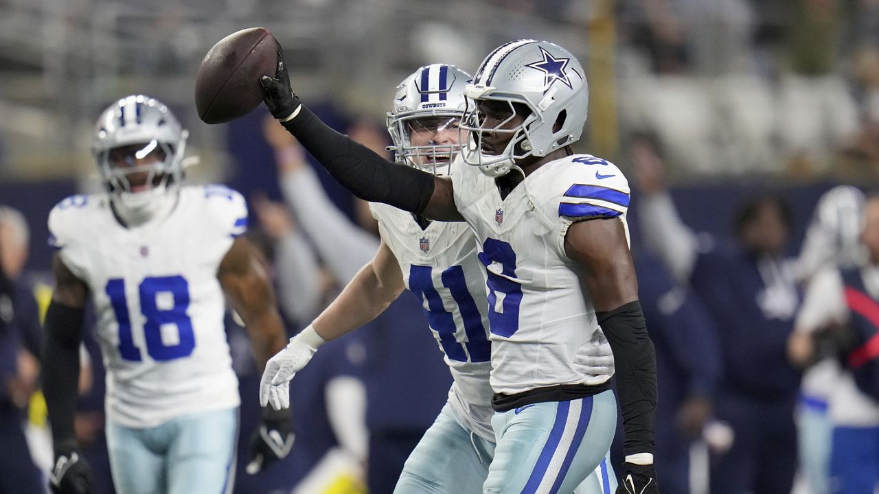 Dallas Cowboys' Donovan Wilson (6) celebrates with Nick Vigil (41) Wilson sacked Tampa Bay Buccaneers' Baker Mayfield (6) and recovered Mayfield's fumble in the second half of an NFL football game in Arlington, Texas, Sunday, Dec. 22, 2024. (AP Photo/Julio Cortez)