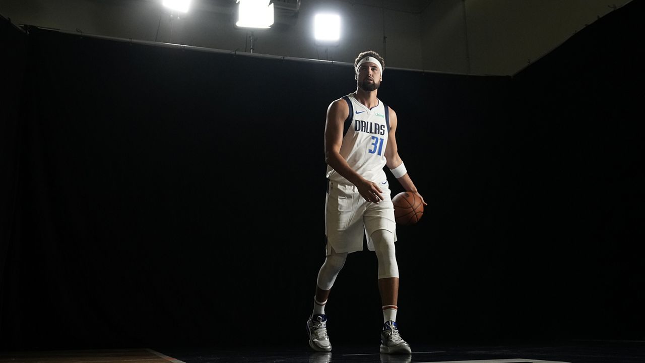 Dallas Mavericks' Klay Thompson poses for photos during the NBA basketball team's media day Monday, Sept. 30, 2024, in Dallas. (AP Photo/LM Otero)