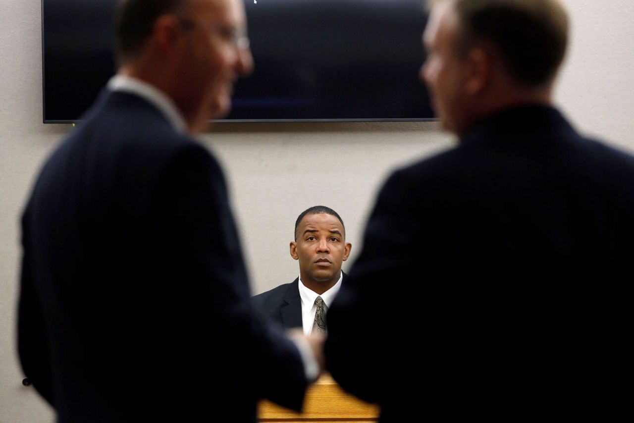 Investigator: Dallas cop's killing of neighbor wasn't crime