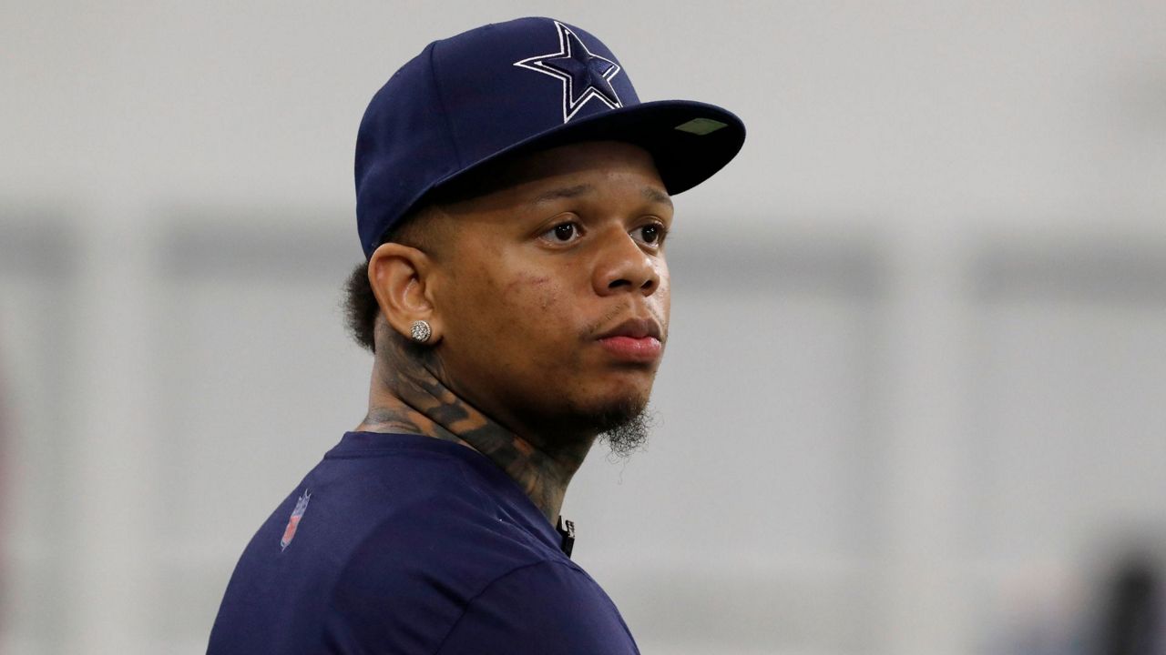 Rapper Yella Beezy watches the the Dallas Cowboys run drills at the team's NFL football training facility in Frisco, Texas, Wednesday, June 12, 2019. (AP Photo/Tony Gutierrez, File)