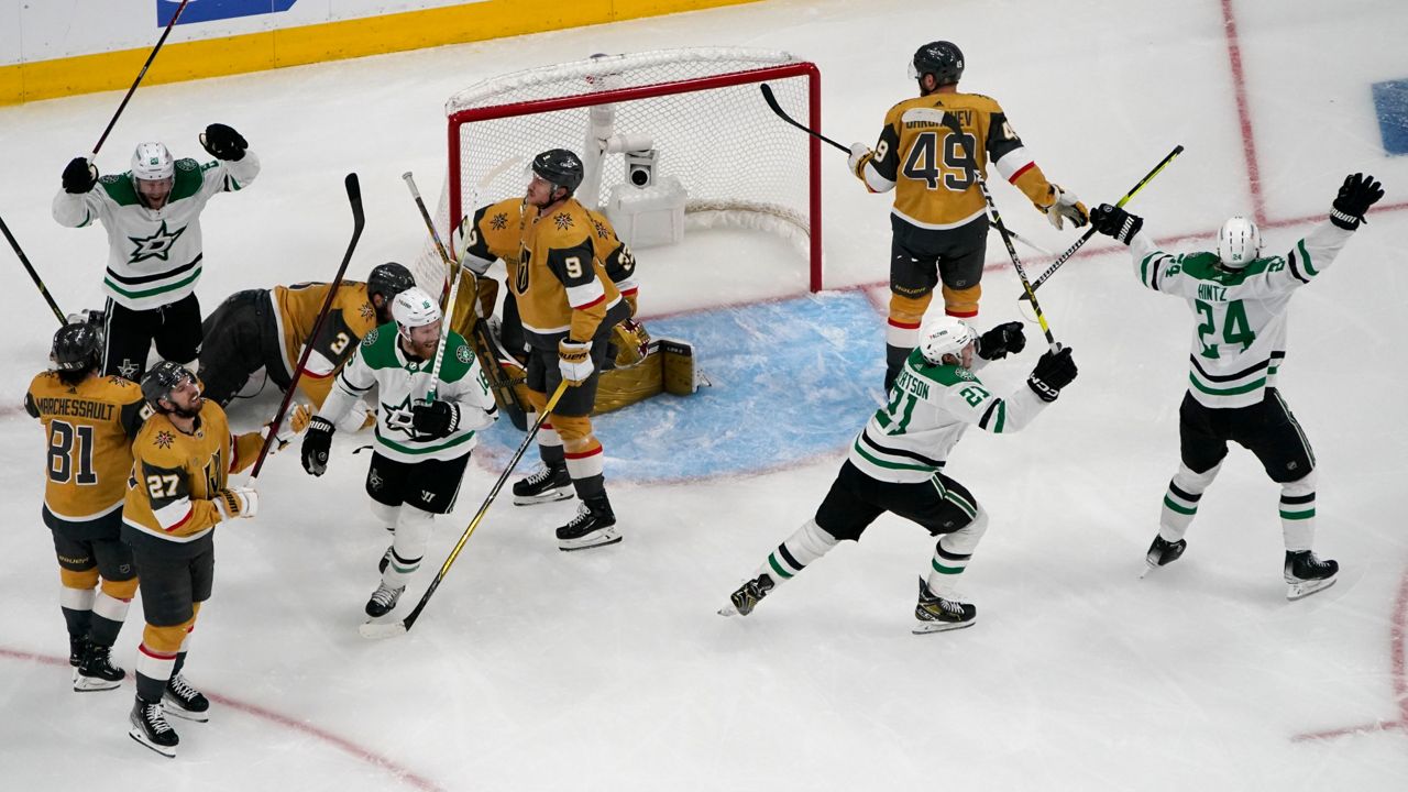 Dallas Stars left wing Jason Robertson (21) celebrates after scoring against the Vegas Golden Knights during the second period of Game 5 of the NHL hockey Stanley Cup Western Conference finals Saturday, May 27, 2023, in Las Vegas. (AP Photo/John Locher)