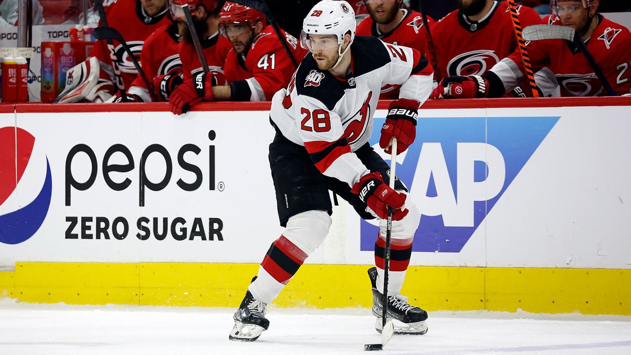 New Jersey Devils' Damon Severson (28) controls the puck against the Carolina Hurricanes during the second period of Game 1 of an NHL hockey Stanley Cup second-round playoff series in Raleigh, N.C., Wednesday, May 3, 2023. (AP Photo/Karl B DeBlaker)