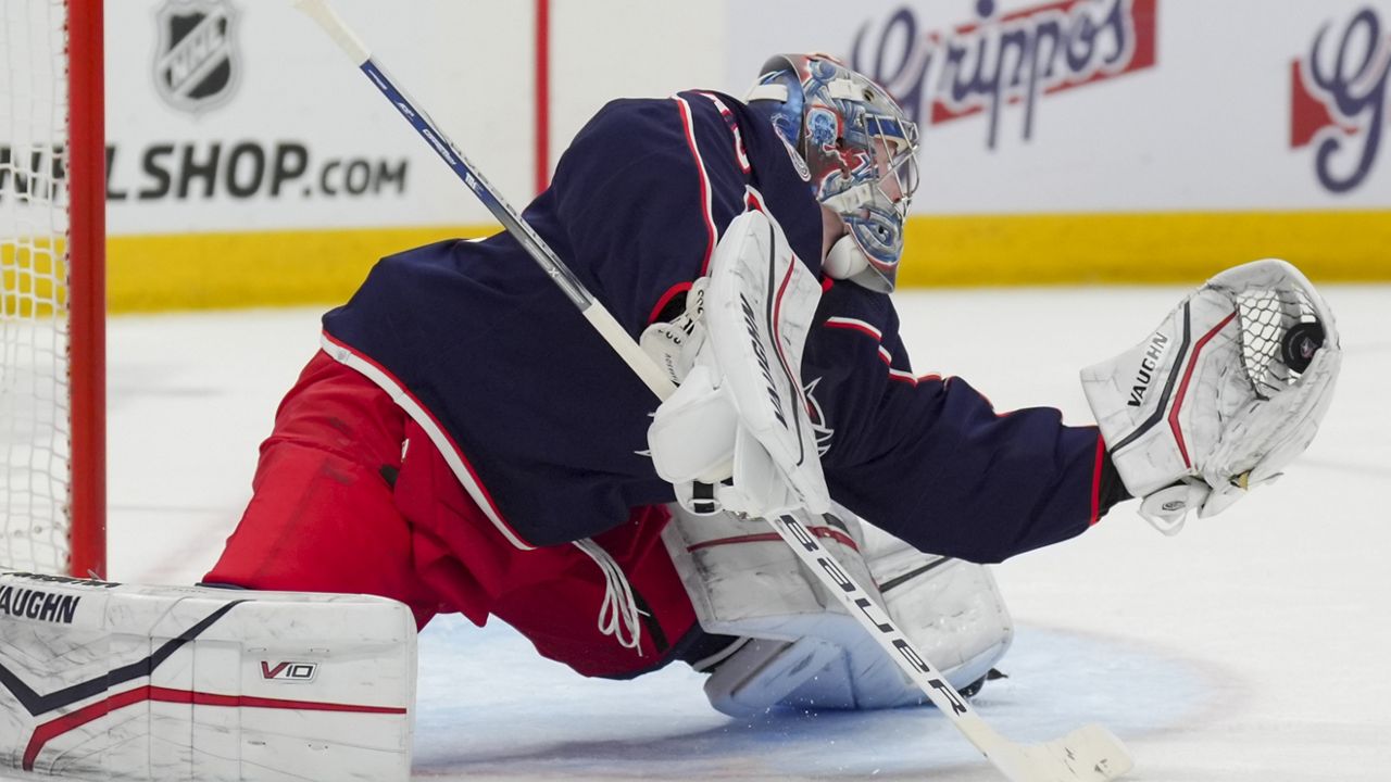 Columbus Blue Jackets' Daniil Tarasov makes a glove save during the first period of an NHL hockey game against the Nashville Predators, Saturday, March 9, 2024, in Columbus, Ohio. (AP Photo/Aaron Doster)