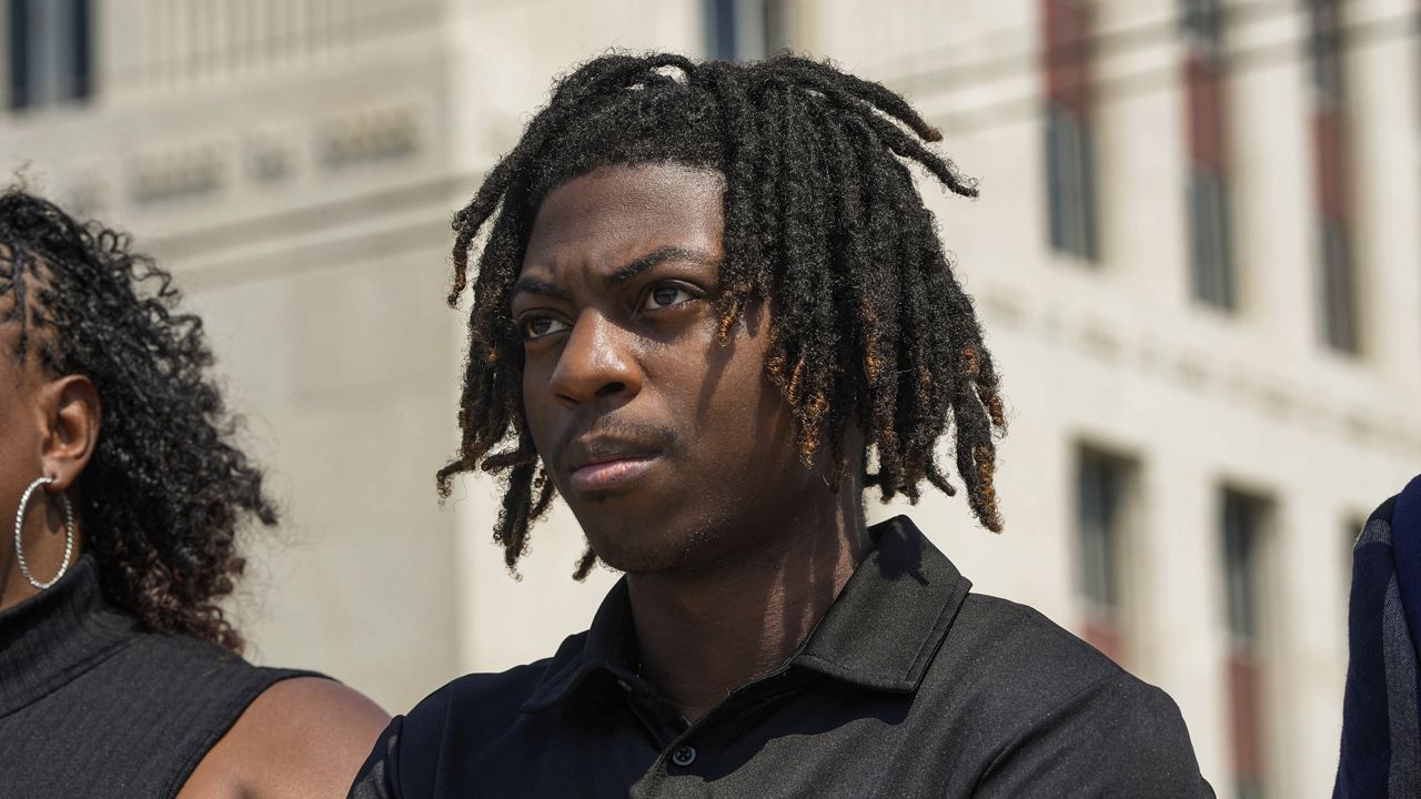 Darryl George stands next to his mother, Darresha George, in front of Galveston County Court House, May 23, 2024, in Galveston, Texas. (Raquel Natalicchio/Houston Chronicle via AP, File)