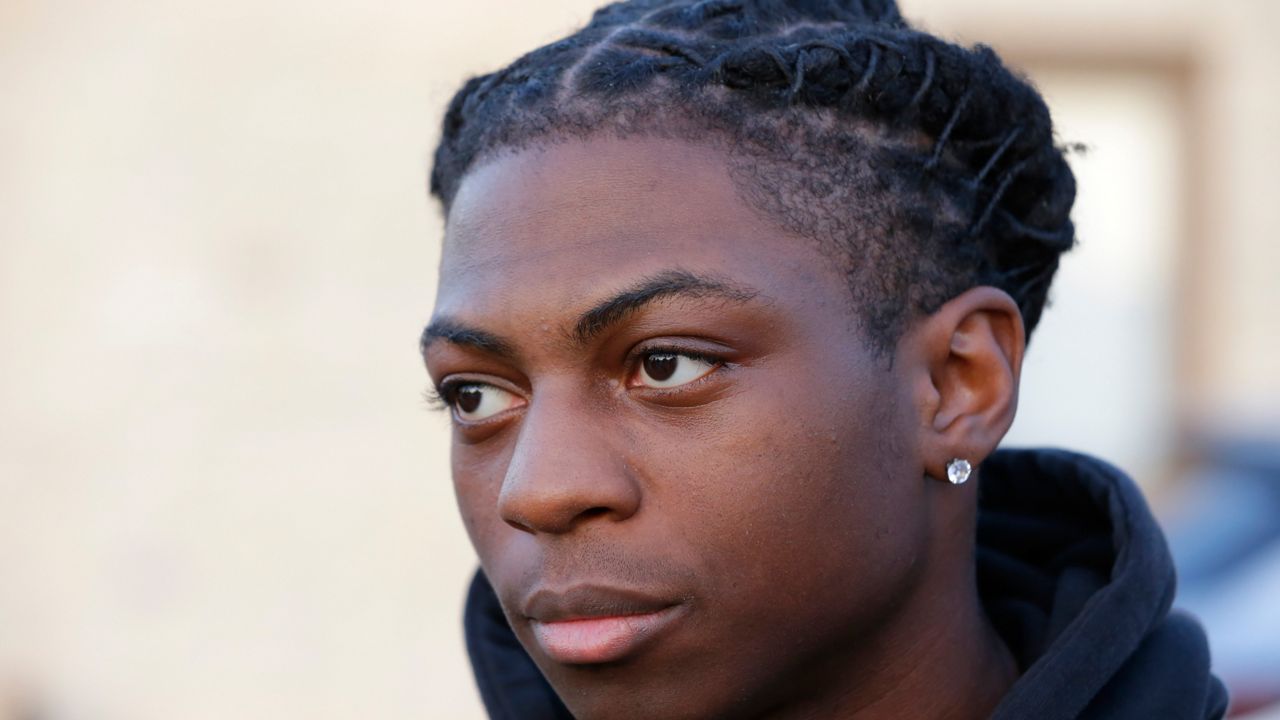 Darryl George, a 17-year-old junior, before walking across the street to go into Barbers Hill High School after serving a 5-day in-school suspension for not cutting his hair Monday, Sept. 18, 2023, in Mont Belvieu. (AP Photo/Michael Wyke)