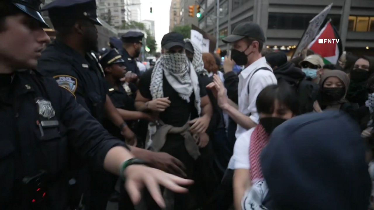 Protesters face off over Israeli real estate event at synagogue
