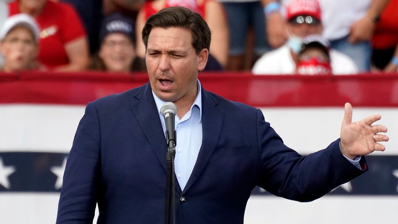 Florida Gov. Ron DeSantis delivers remarks to supporters at a campaign rally for President Donald Trump Friday, Oct. 23, 2020, in The Villages, Fla. (AP Photo/John Raoux)