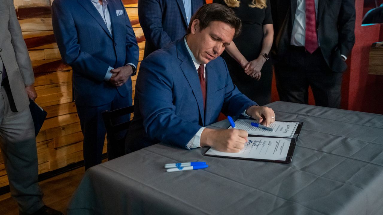 Gov. Ron DeSantis signs a bill creating Florida's Office of Election Crimes and Security on on April 25, 2022. (DeSantis' Office)