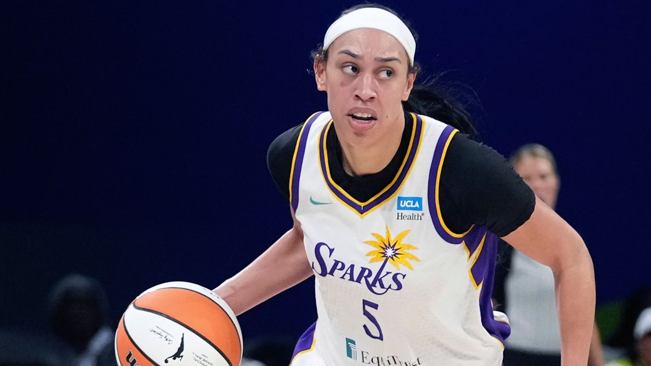 Los Angeles Sparks forward Dearica Hamby dribbles during the second half of a WNBA basketball game against the Dallas Wings in Arlington, Texas, Wednesday, June 14, 2023. (AP Photo/LM Otero)