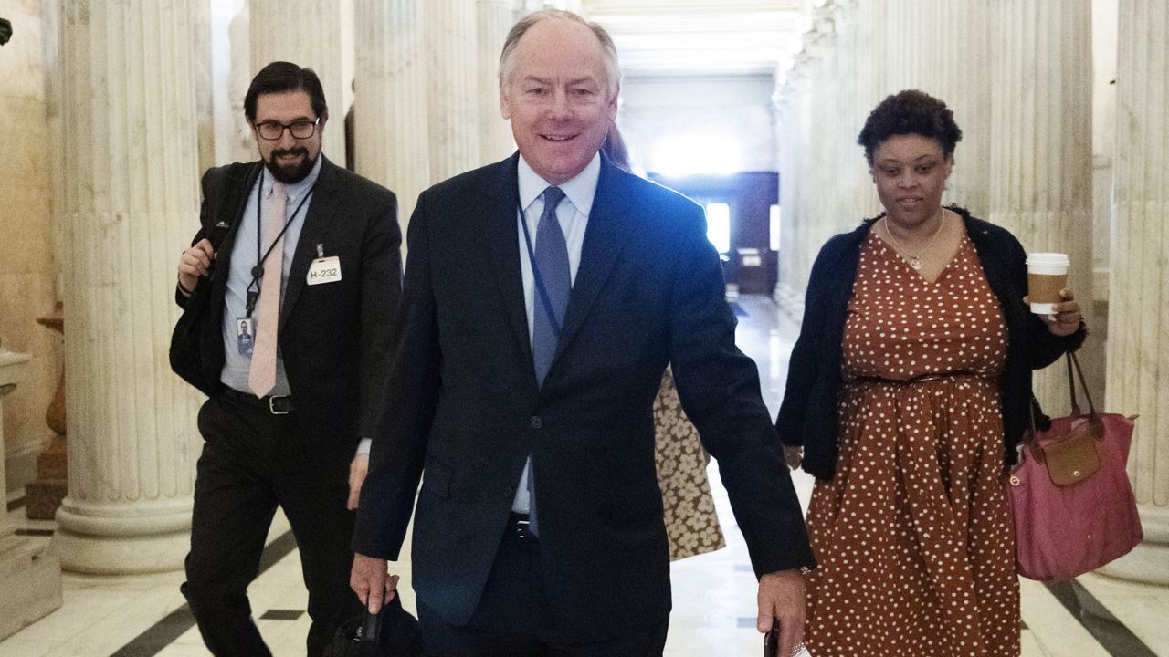 Steve Ricchetti, counselor to the president and a top negotiator for President Joe Biden on the debt limit crisis, center, and Shalanda Young, director of the Office of Management and Budget, right, arrive at the Capitol, Monday, May 22, 2023, on Capitol Hill in Washington. (AP Photo/Jacquelyn Martin)