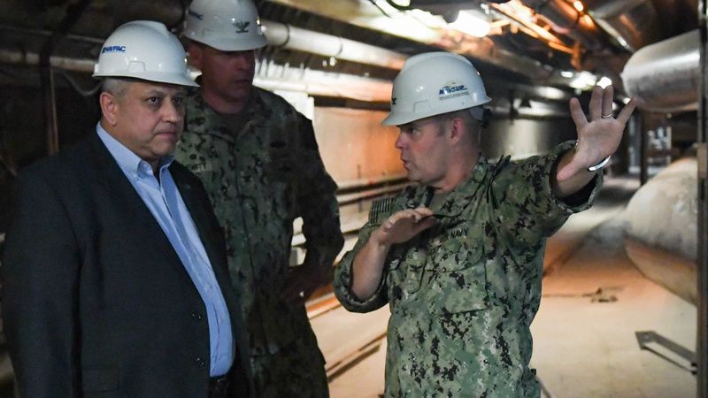 Navy Secretary Carlos Del Toro (left) receives a brief from Capt. Bert Hornyak, commanding officer, Naval Supply Systems Command Fleet Logistics Center Pearl Harbor, during a tour of the Red Hill Well in Aiea, Hawaii. (Photo courtesy of U.S. Navy)