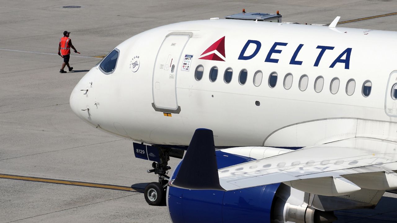 A Delta Air Lines jet leaves the gate, July 19, 2024, at Logan International Airport in Boston. Delta CEO Ed Bastian says the airline is facing $500 million in costs for the global technology breakdown that happened earlier this month. (AP Photo/Michael Dwyer, File)