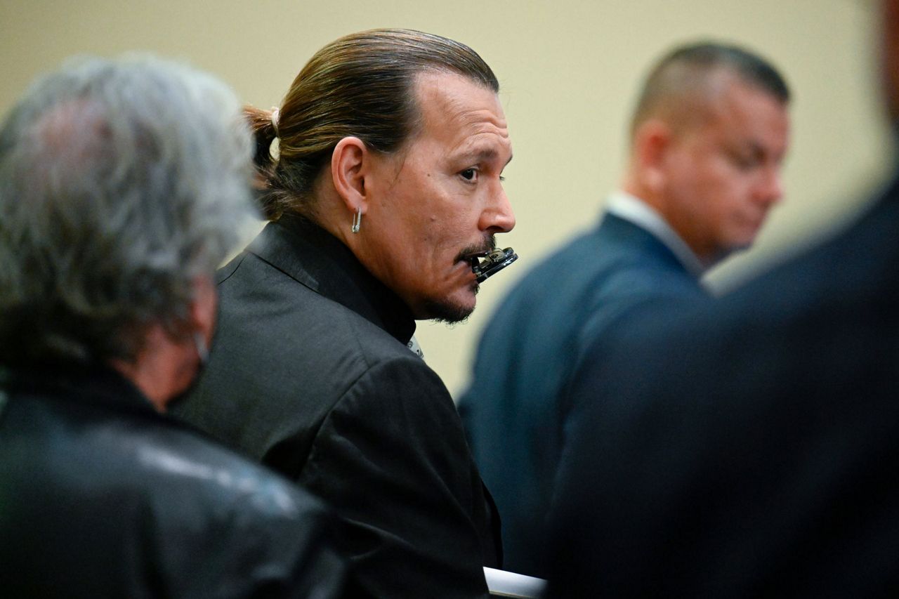 Johnny Depp takes stand in suit against ex-wife Amber Heard