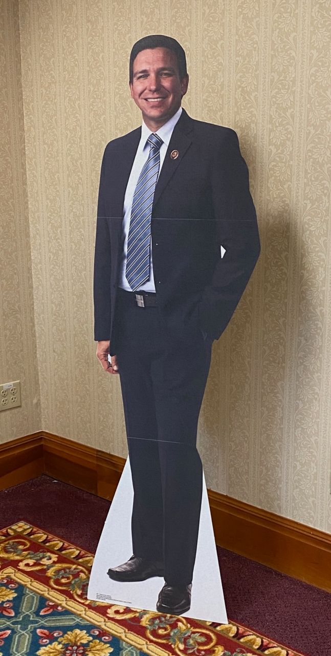 Attendees used a standup image of Gov. Ron DeSantis for selfies in the lobby at Quaker Station. (Spectrum News 1/Jennifer Conn)