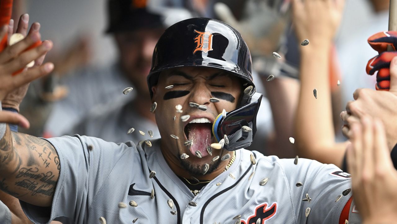 Detroit Tigers' Javier Báez celebrates with teammates after hitting a three-run home run during the second inning of a baseball game against the Cleveland Guardians, Thursday, July 25, 2024, in Cleveland. (AP Photo/Nick Cammett)