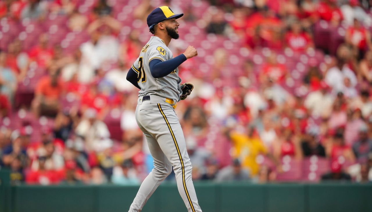 Milwaukee Brewers' Devin Williams celebrates after the final out of the ninth inning of a baseball game against the Cincinnati Reds in Cincinnati, Sunday, July 16, 2023. (AP Photo/Aaron Doster)