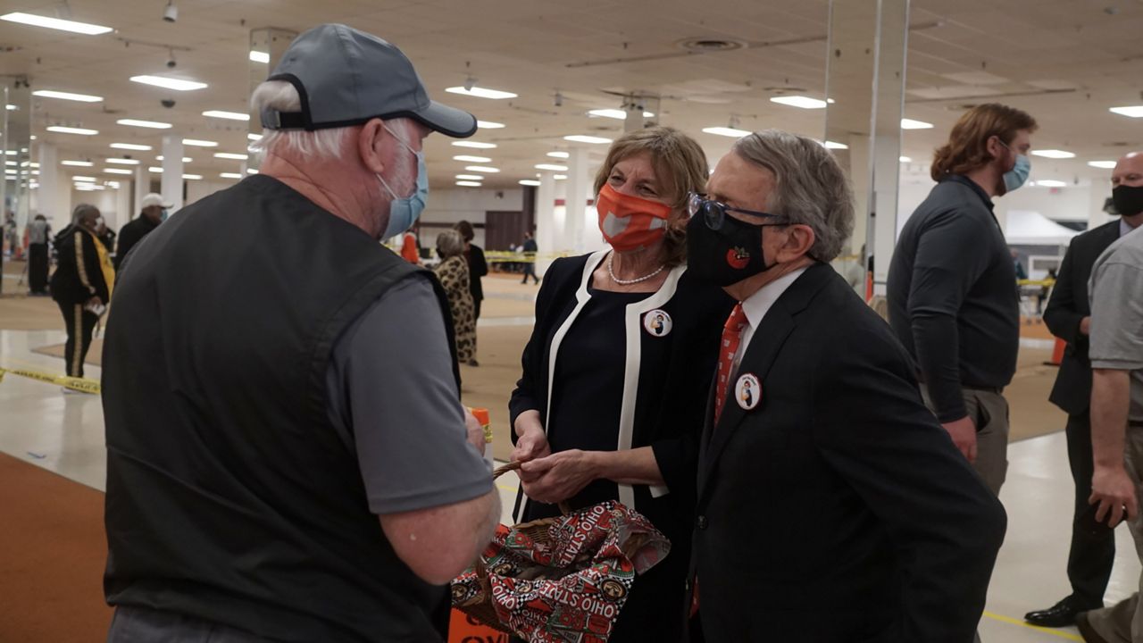 Mike Dewine talking to people