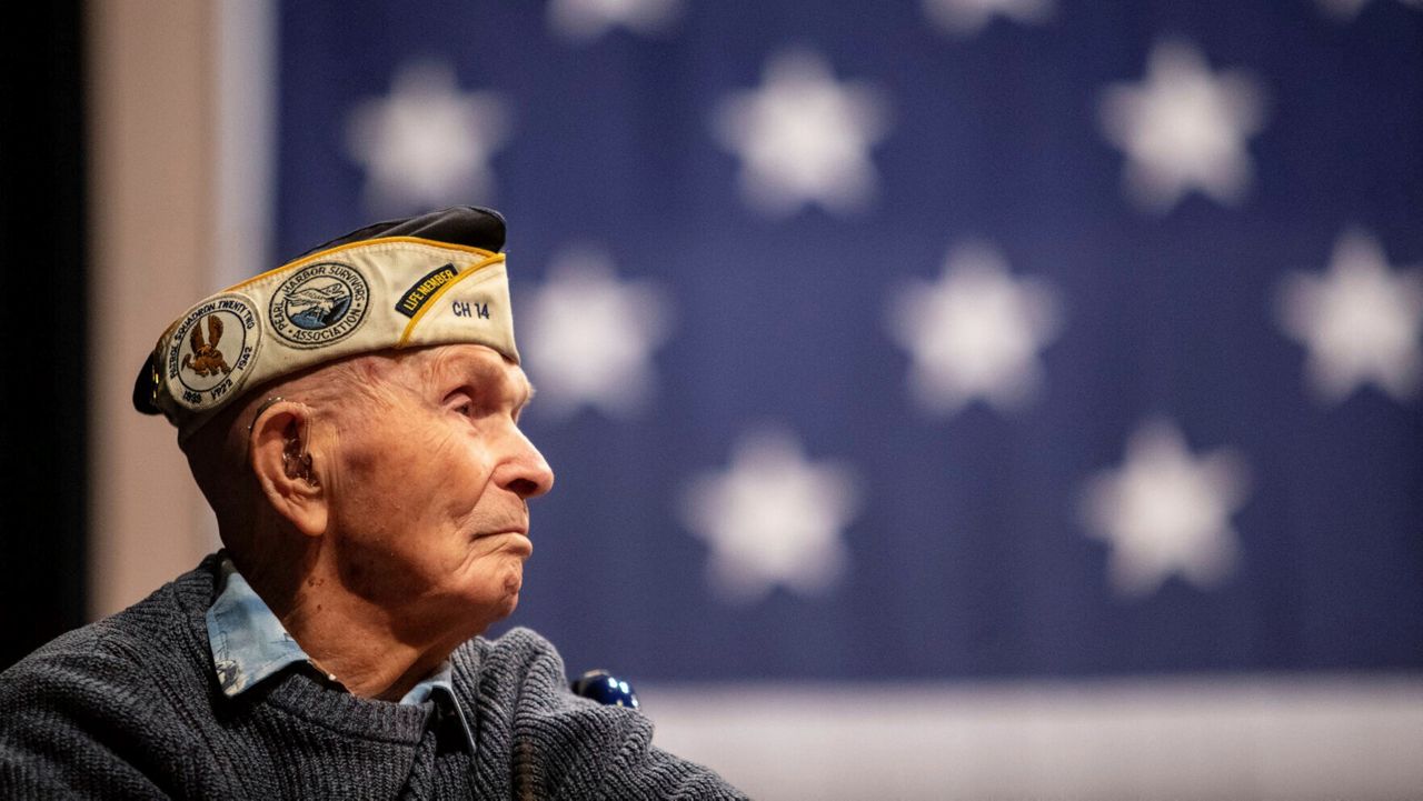 Pearl Harbor survivor Dick Higgins listens to a speaker during a ceremony at Bend High School in Bend, Ore., on Dec. 7, 2023, to honor him as well as those who died in the Dec. 7, 1941 attack on Pearl Harbor. (Joe Kline/The Bulletin via AP)