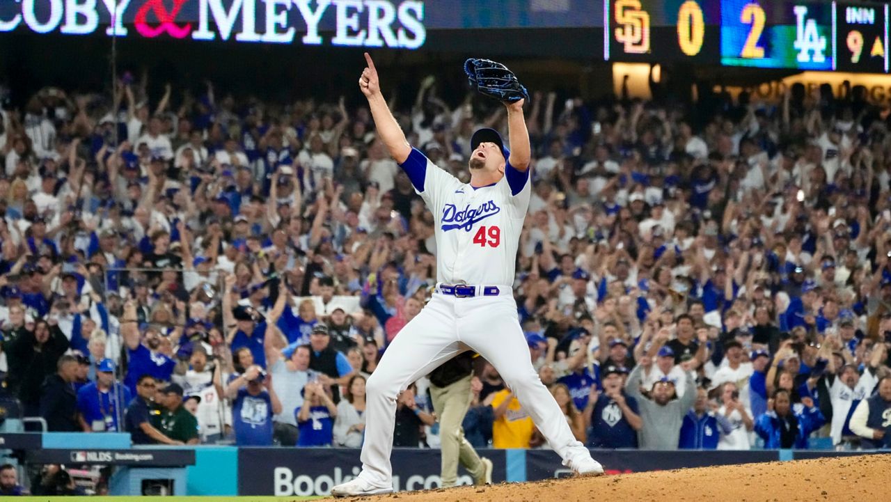 Los Angeles Dodgers relief pitcher Blake Treinen celebrates after the last out in the ninth inning in Game 5 of a baseball NL Division Series against the San Diego Padres, Friday, Oct. 11, 2024, in Los Angeles. (AP Photo/Mark J. Terrill)