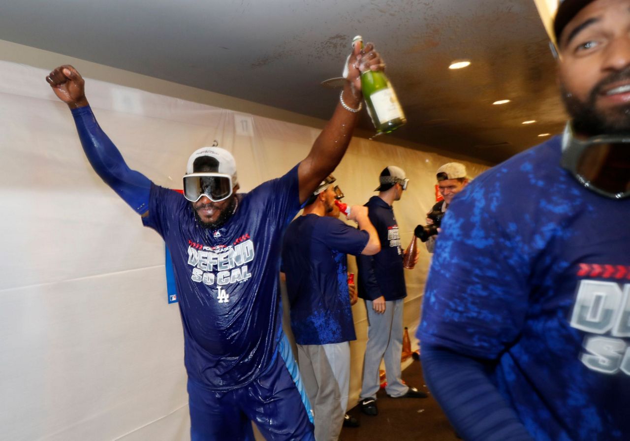 Los Angeles Dodgers celebrate in the lockerroom after beating the