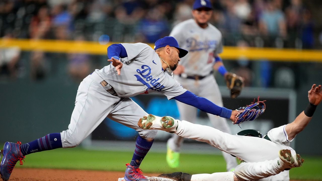 Dodgers beat Rockies 8-2 to near 3rd straight 100-win season