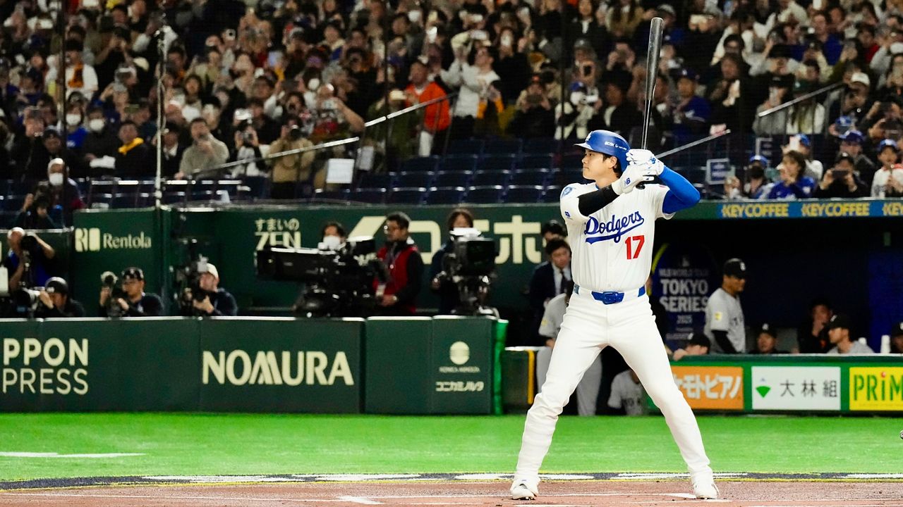 Los Angeles Dodgers' Shohei Ohtani waits on a pitch in the first inning of a spring training baseball game against the Yomiuri Giants in Tokyo, Japan, Saturday, March 15, 2025. (AP Photo/Eugene Hoshiko)