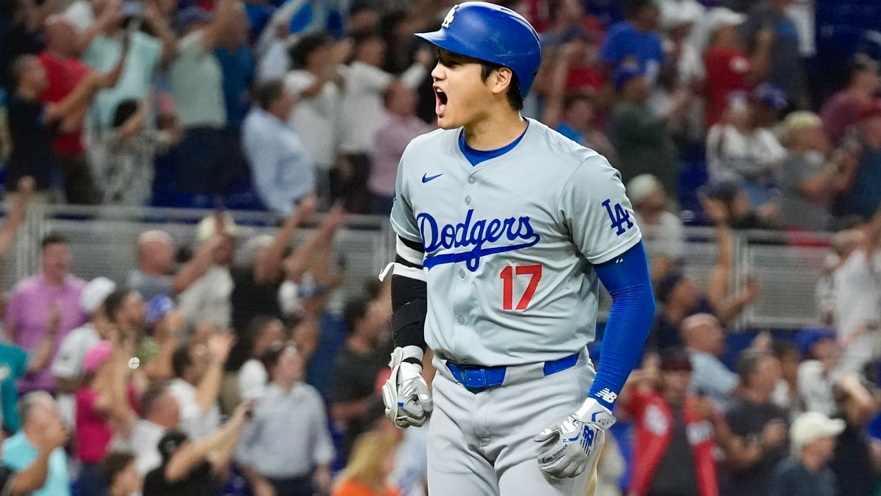 Los Angeles Dodgers' Shohei Ohtani (17) reacts after hitting his 50th home run of the season during the seventh inning of a baseball game against the Miami Marlins, Thursday, Sept. 19, 2024, in Miami. (AP Photo/Marta Lavandier)