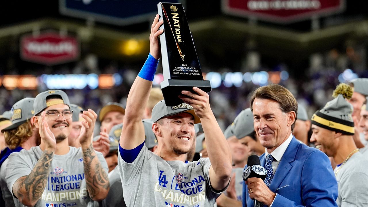 Los Angeles Dodgers' Tommy Edman celebrates after their win against the New York Mets in Game 6 of a baseball NL Championship Series, Sunday, Oct. 20, 2024, in Los Angeles.