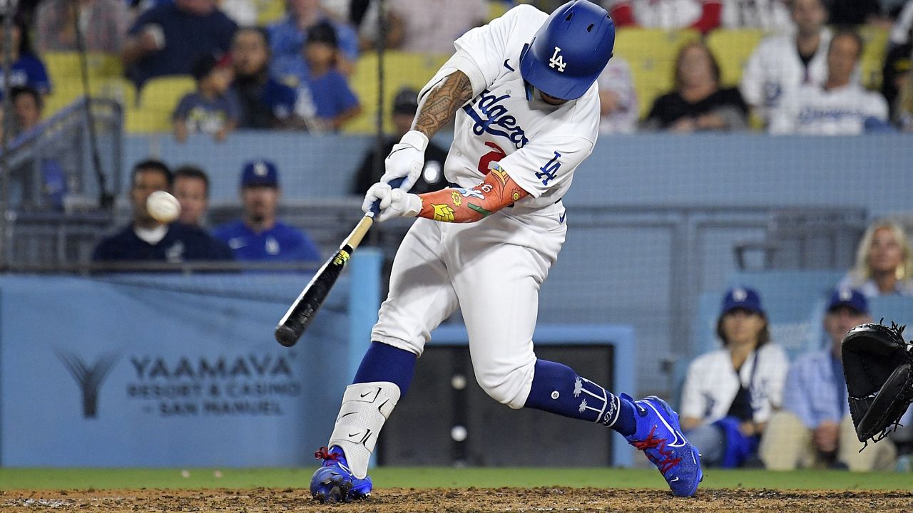 New Dodger Kolten Wong hit a pinch-hit home run in the eighth inning against the Atlanta Braves on Friday.