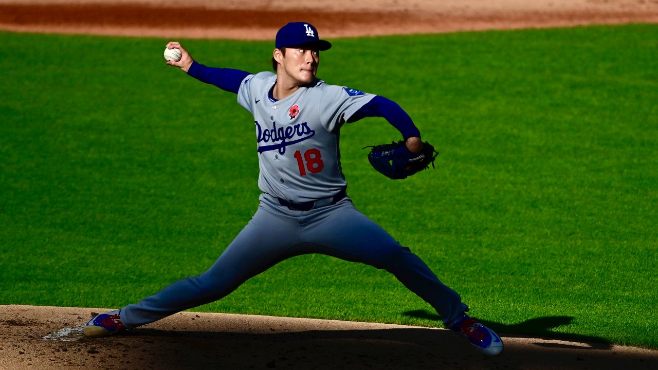 Los Angeles Dodgers' Shohei Ohtani (17), of Japan, reacts while throwing live batting practice before a baseball game against the New York Mets on Sunday, May 25, 2025, in New York. (AP Photo/Adam Hunger)