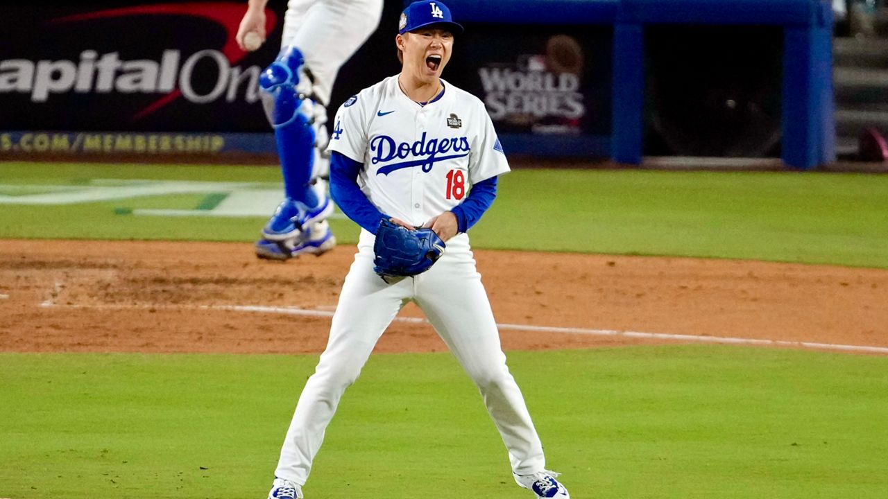 Los Angeles Dodgers starting pitcher Yoshinobu Yamamoto (18) reacts after striking out New York Yankees' Anthony Rizzo during the fourth inning in Game 2 of the baseball World Series, Saturday, Oct. 26, 2024, in Los Angeles. (AP Photo/Julio Cortez)